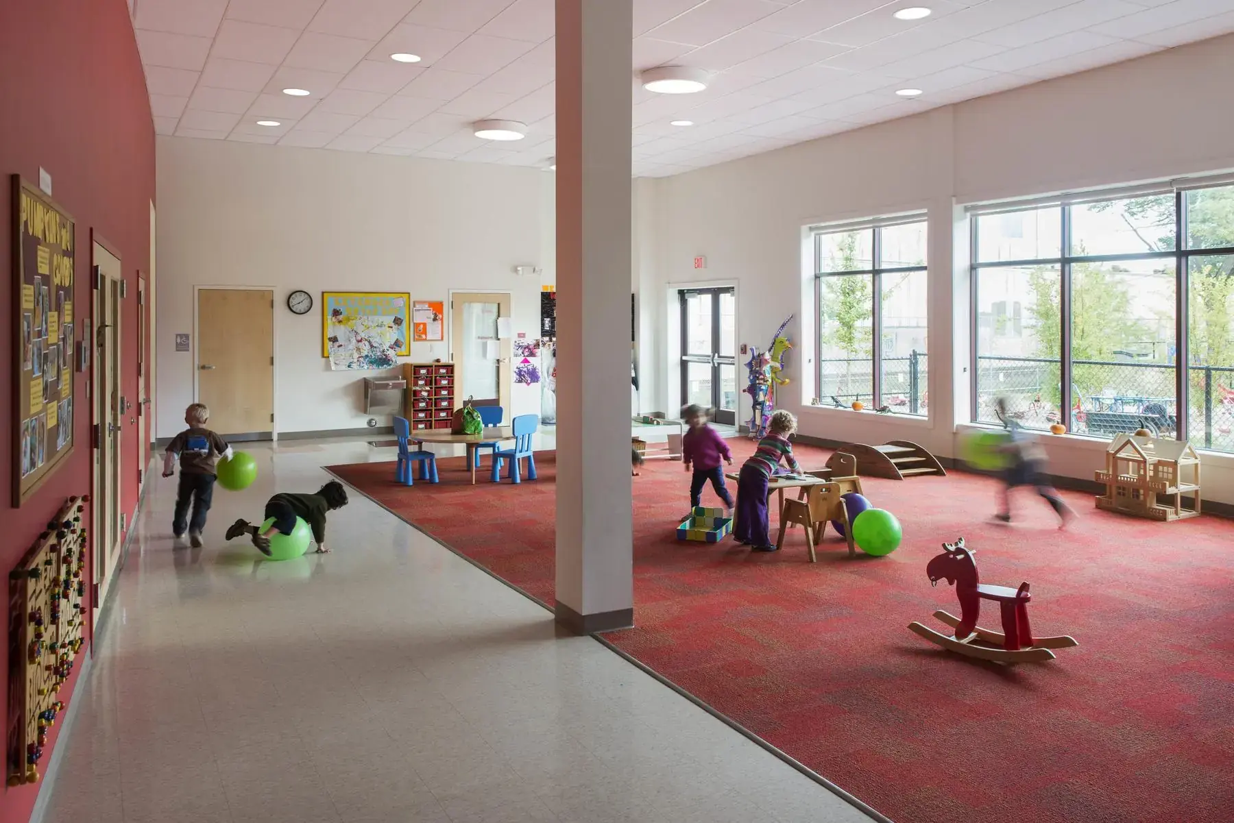 The Bigelow gross motor room — a wide, light-filled space with children at play